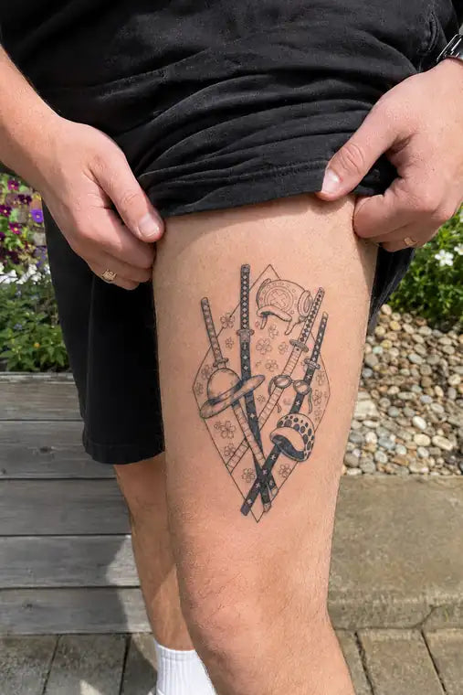 Customer wearing ANIMETAT anime sword tattoo on thigh